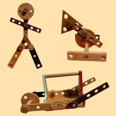 Three wooden mechanical models, including a figure and geometric shapes, on a light background.
