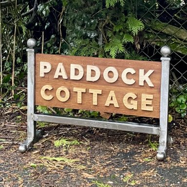 Wooden house sign with steel frame 