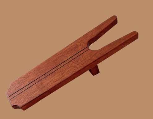 A boot jack in recycled mahogany wood 