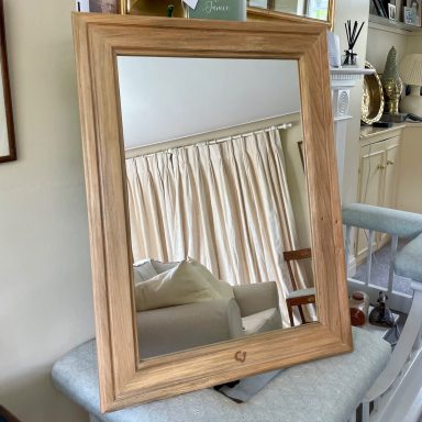 A mirror with a lime frame