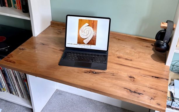 A laptop on a wooden desk